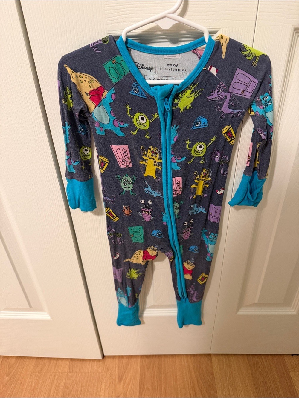 Disney Navy Monsters Footie with Bright Teal Trim